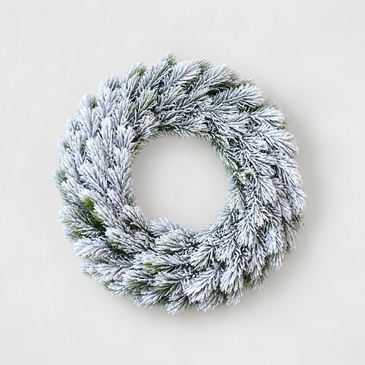 Large plain frosted pine Christmas wreath, 16 inches across, on a light grey background