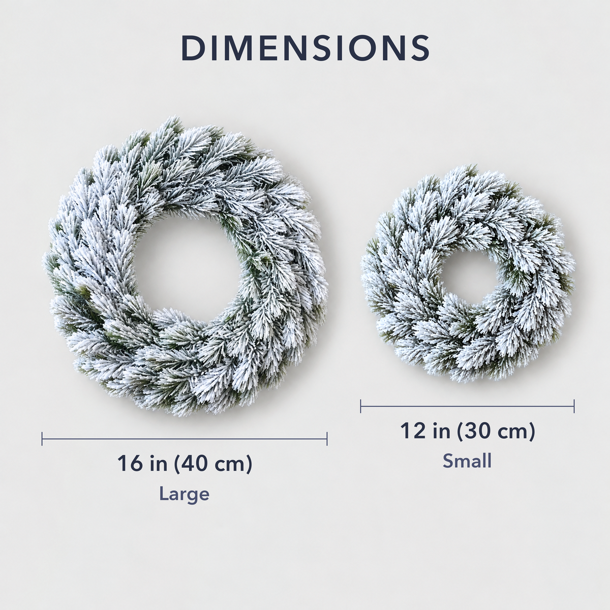 The large 16 inch and small 12 inch frosted pine wreaths side by side to show their sizes