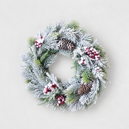 Small frosted pine wreath with red and white berries and pine cones, 12 inches across, on a light grey background