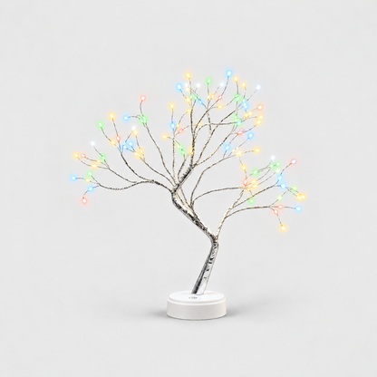 LED tree lamp with silver branches and multicolor fairy lights, lit, on a white round base