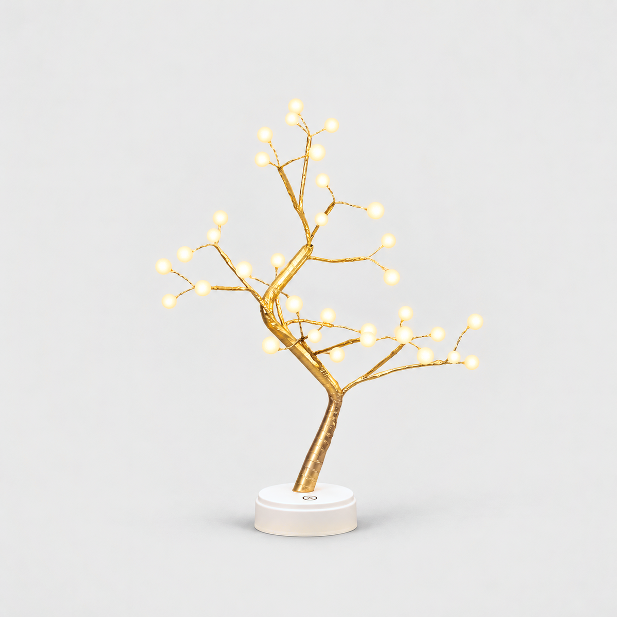LED tree lamp with gold branches and 36 glowing white pearl lights on a white round base