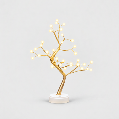 LED tree lamp with gold branches and 36 glowing white pearl lights on a white round base