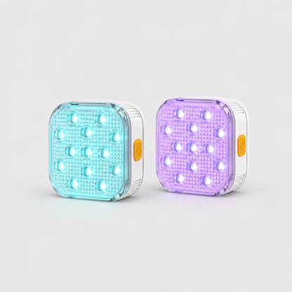 Two square rechargeable pool lights glowing aqua and violet, white body with an orange power button on the side