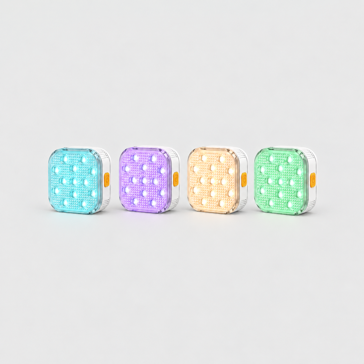 Set of four square pool lights glowing aqua, violet, warm white and mint green