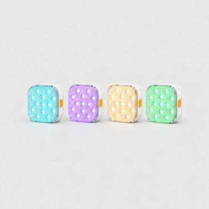 Set of four square pool lights glowing aqua, violet, warm white and mint green