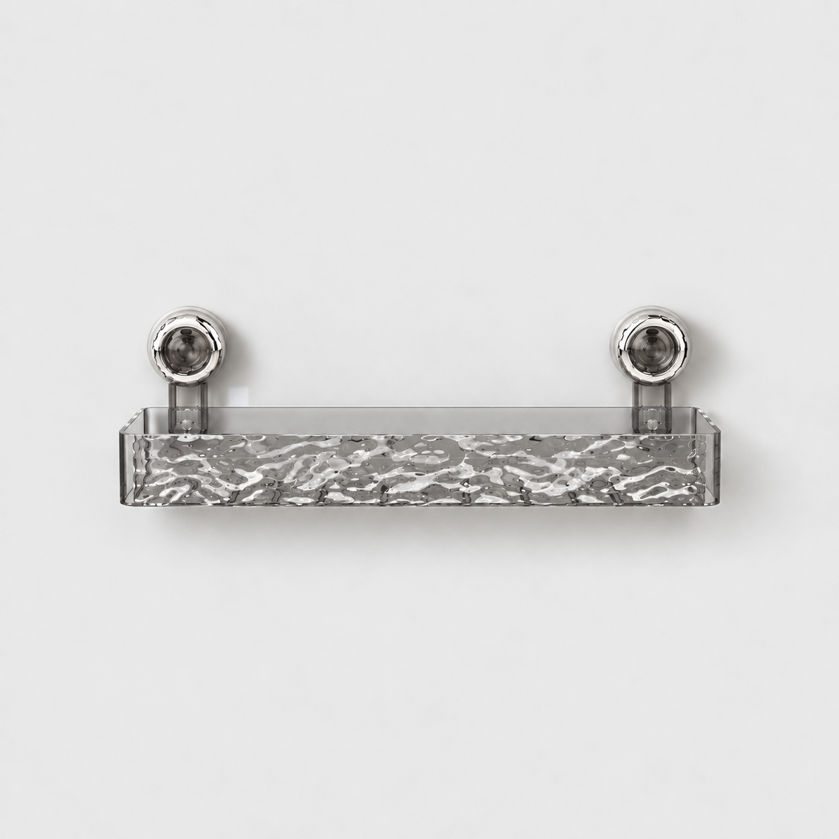Gray see-through long shower shelf with a rippled front and a row of drain slots in its floor, on two chrome suction cups
