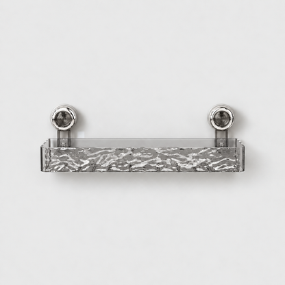 Gray see-through long shower shelf with a rippled front and a row of drain slots in its floor, on two chrome suction cups