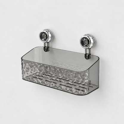 Gray see-through deep shower basket with a rippled front, flat sides that slope down to the front and two chrome suction cups