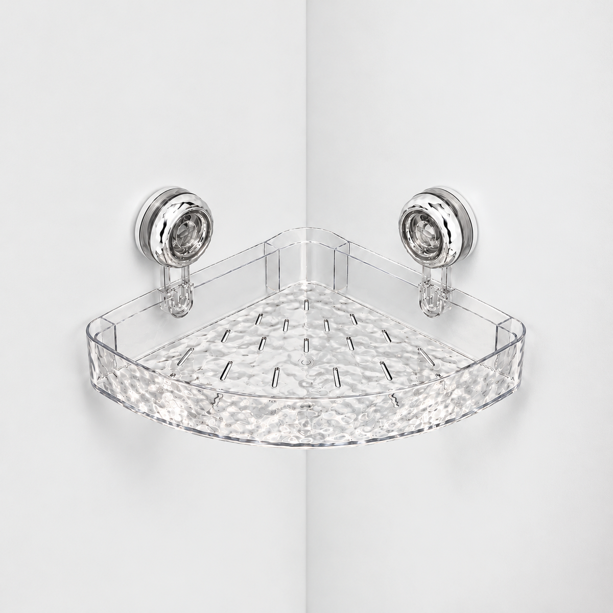 Clear corner shower shelf with a rippled front and a slotted rippled floor, held in a light grey corner by two chrome suction cups