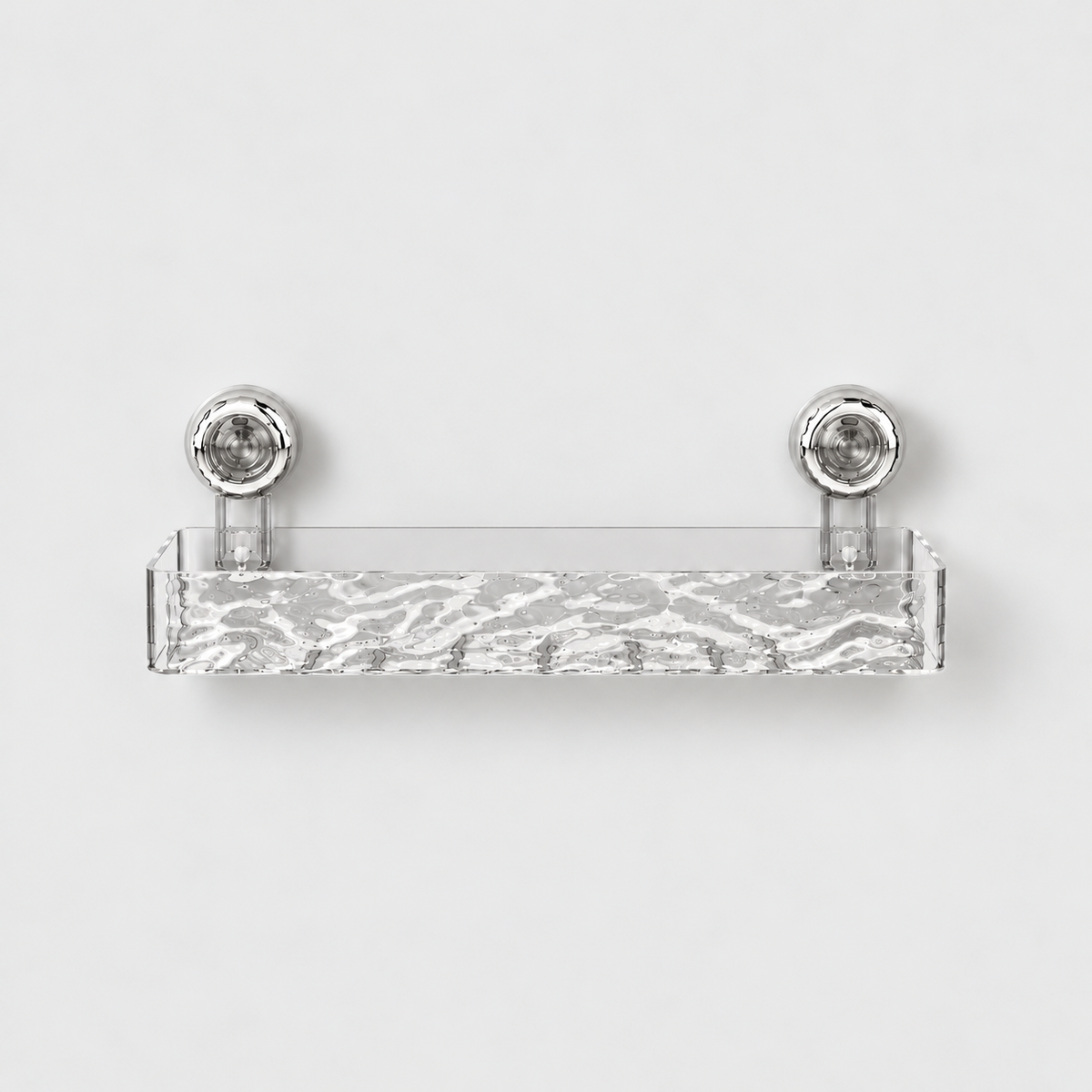 Clear long shower shelf with a rippled front and a row of drain slots in its floor, on two chrome suction cups