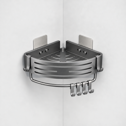 Gray aluminum corner shower basket with a slotted curved front, a towel bar and four hooks underneath, hung in a light grey corner with the tops of its two wall plates just showing behind it