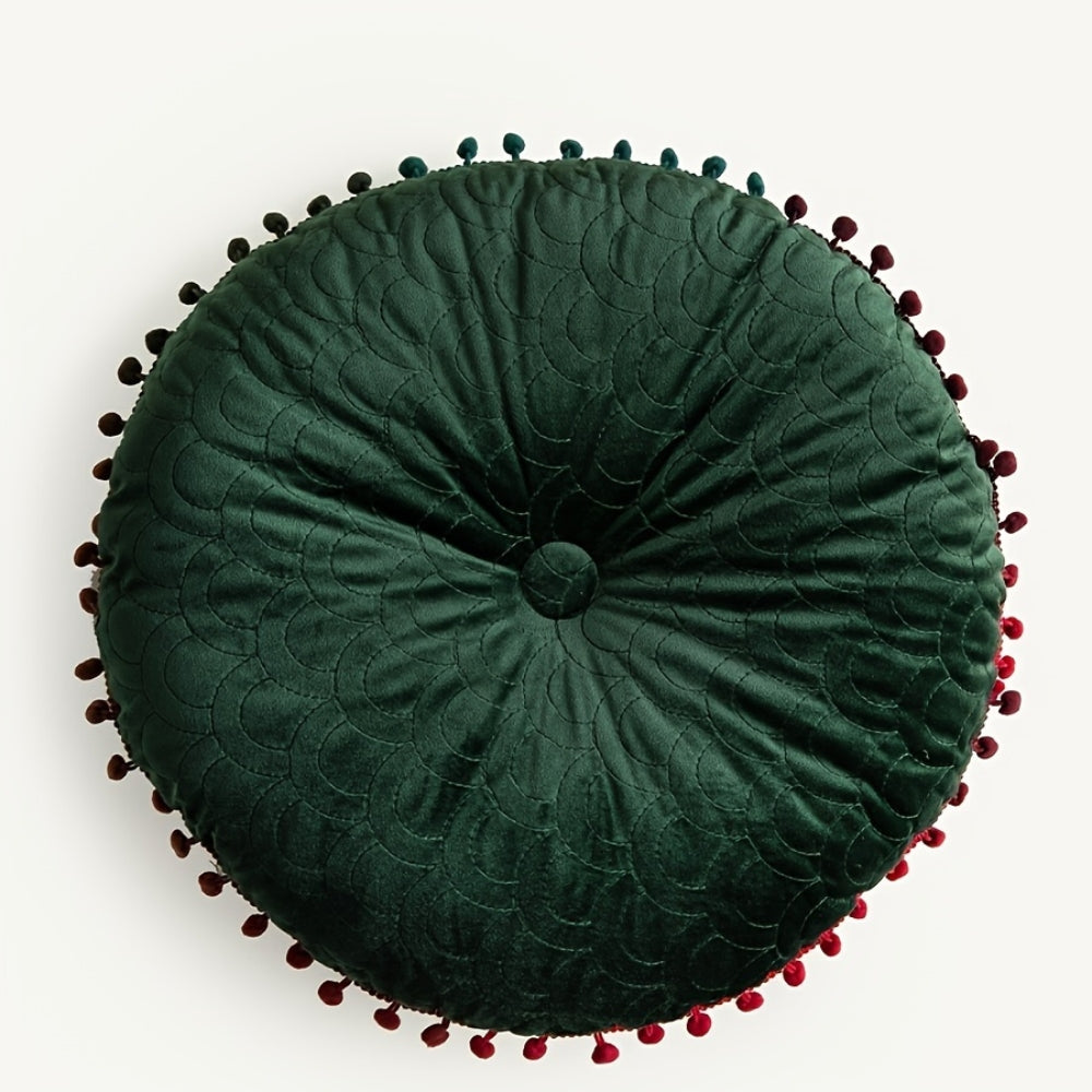 Green round velvet cushion seen from above