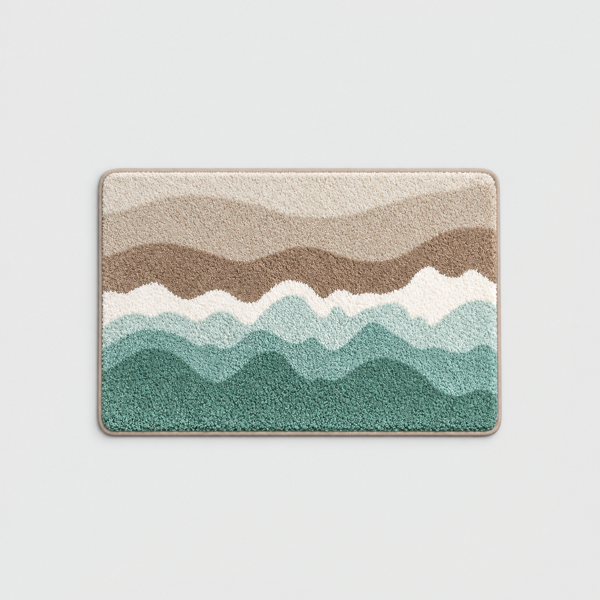 Sand wave pattern bath mat with cream, taupe, white and sea green bands, on a light gray background