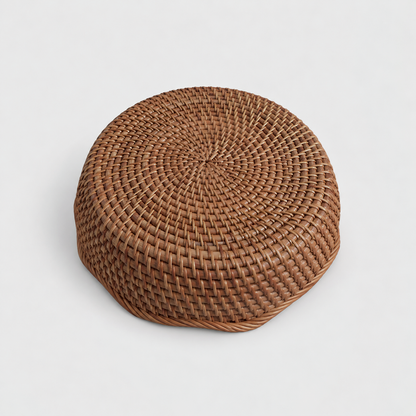 Underside of the rattan basket showing its flat round base woven in a spiral
