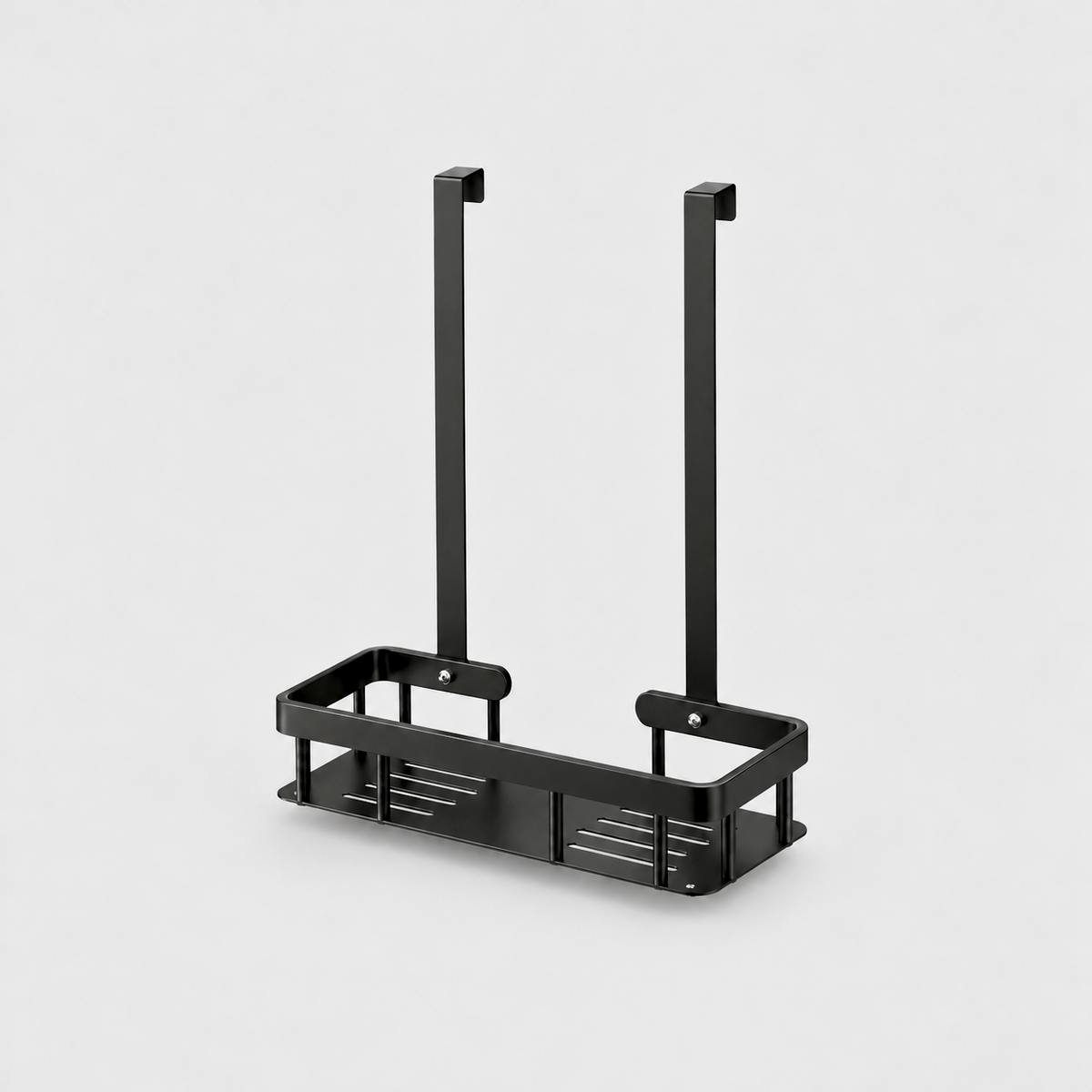 Black metal hanging shower caddy with one slotted basket and two flat door hooks, on a light gray background