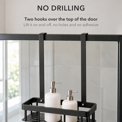 Two flat black hooks over the top rail of a glass shower door, with text saying the caddy hangs on with no drilling