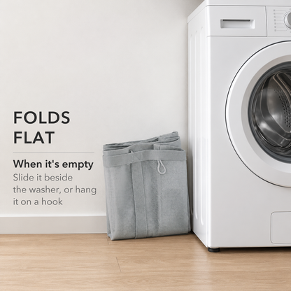 Gray mesh laundry basket folded flat beside a washing machine, text reads Folds flat when it's empty