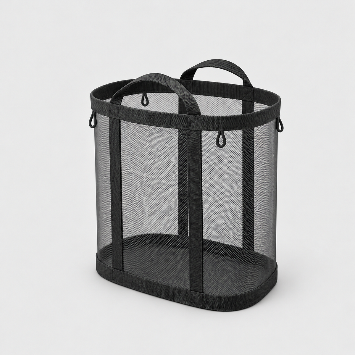 Black mesh laundry basket with two carry handles on a plain gray background