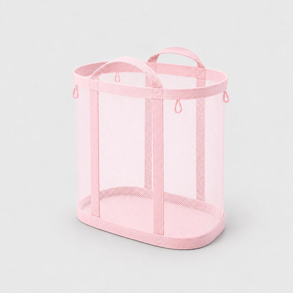 Pink mesh laundry basket with two carry handles on a plain gray background