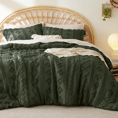 Olive green tufted duvet cover set on a bed with a rattan headboard