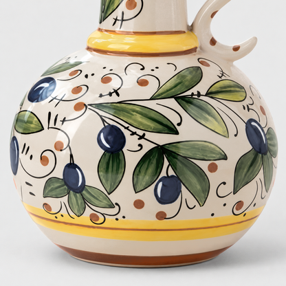 Close-up of the painted olives and leaves on the glazed ceramic body