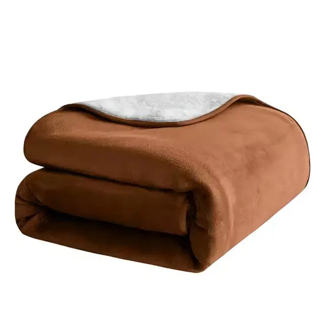 Brown waterproof pet blanket folded on a white background, the pale fleece reverse turned back on top