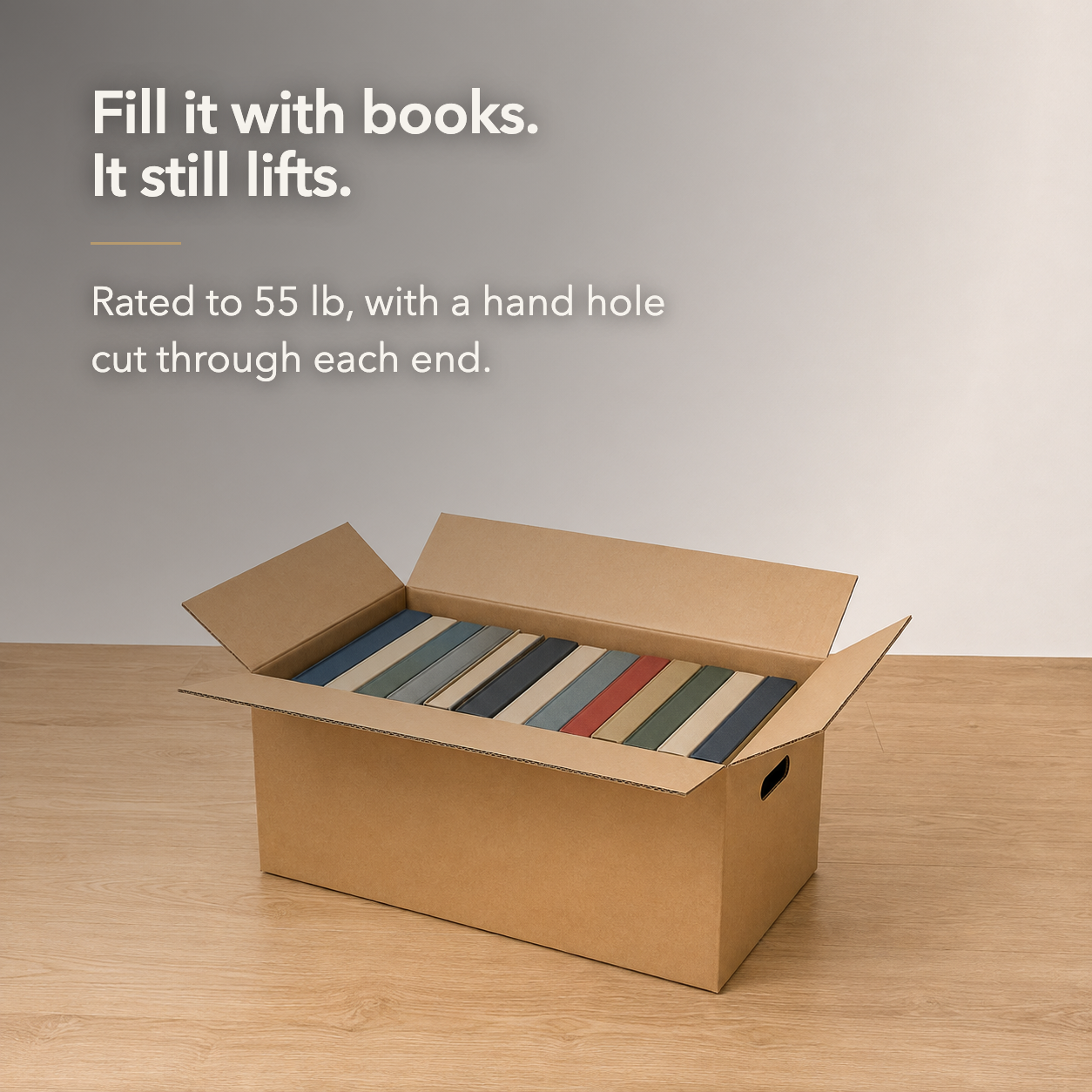 Fill it with books and it still lifts - an open cardboard moving box packed with books standing upright
