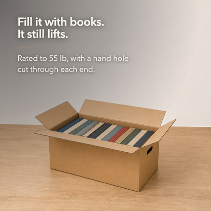 Fill it with books and it still lifts - an open cardboard moving box packed with books standing upright