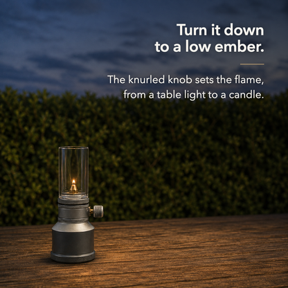 Turn it down to a low ember. The knurled knob sets the flame, from a table light to a candle.