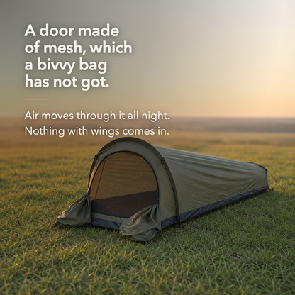 Army Green tent at golden hour with the mesh door open, captioned: a door made of mesh, which a bivvy bag has not got