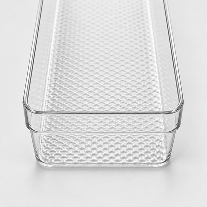 Close-up of the clear tray's rounded corner, flat rim and textured floor