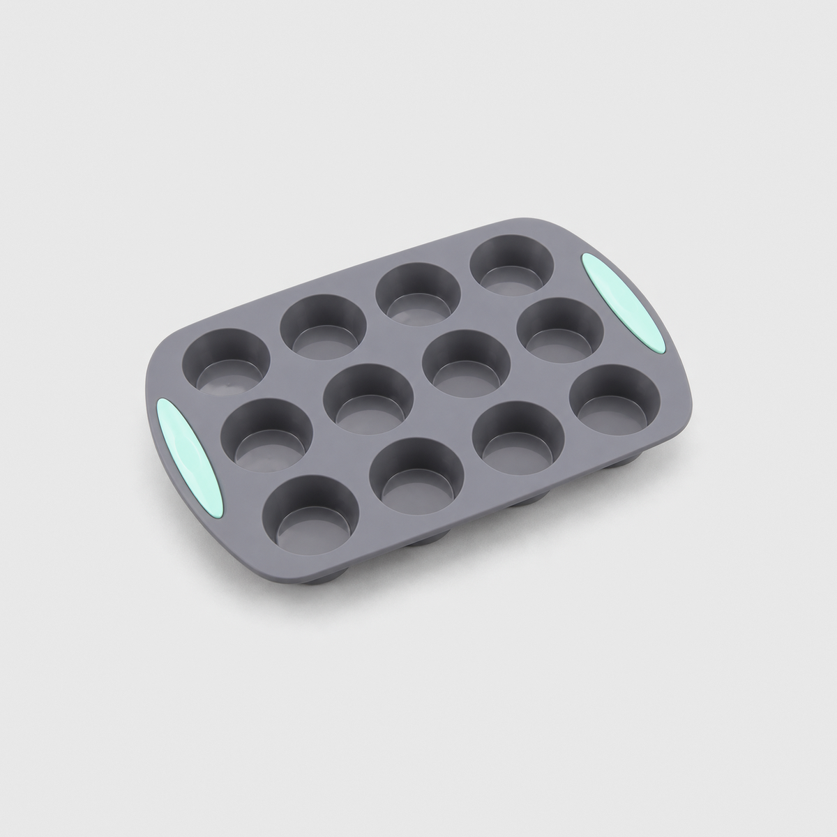 Gray silicone 12-cup muffin pan with mint-green pads at both ends, on a light gray background