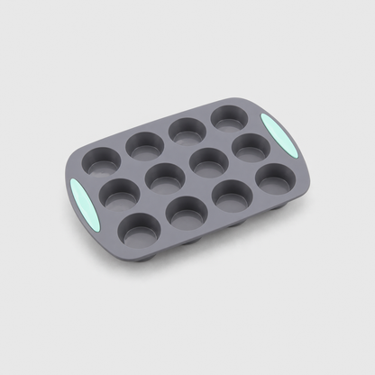Gray silicone 12-cup muffin pan with mint-green pads at both ends, on a light gray background