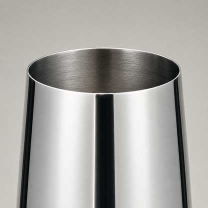 Close-up of the champagne flute rim showing the mirror polished exterior and brushed interior