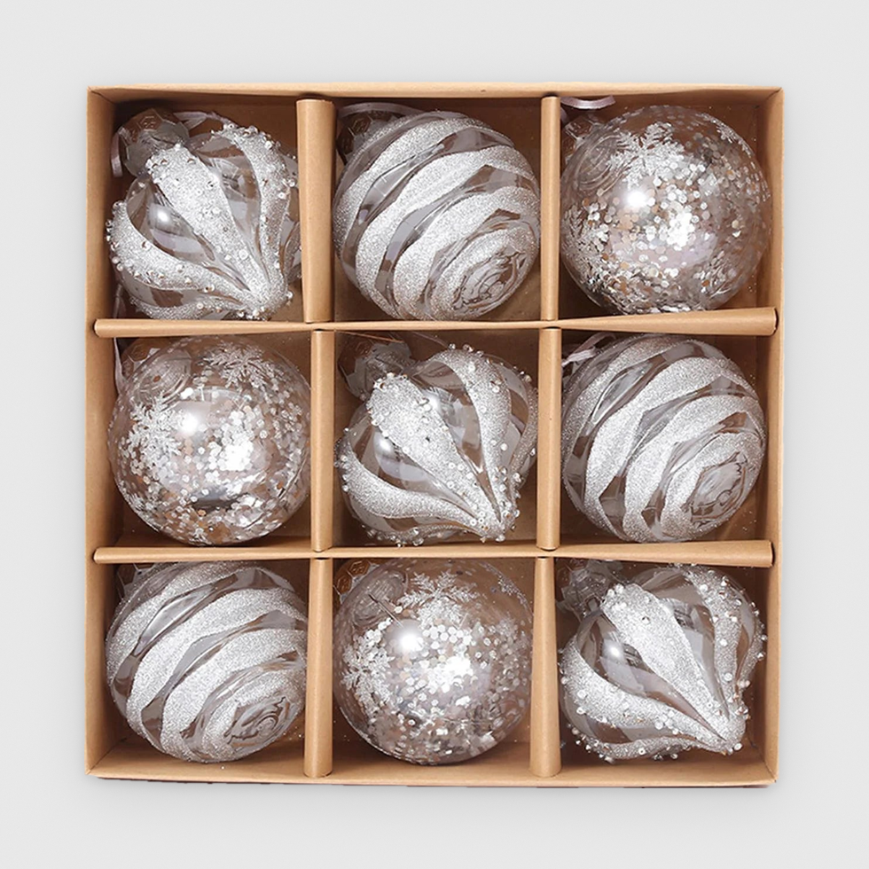 Box of 9 clear Christmas baubles with silver-white glitter in droplet, swirl and sequin designs