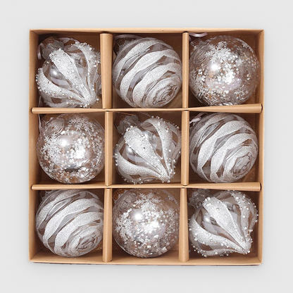 Box of 9 clear Christmas baubles with silver-white glitter in droplet, swirl and sequin designs