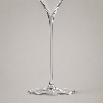 The fine stem drawn in one piece into the thin flat foot