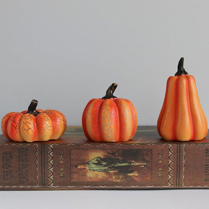 The tall gourd, medium pumpkin and short round pumpkin side by side