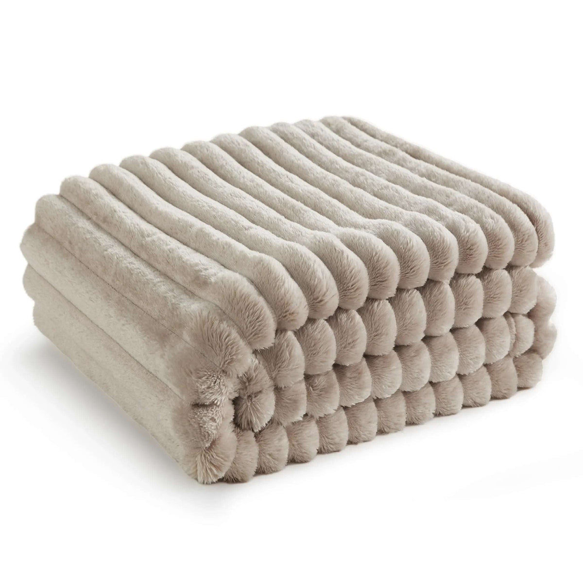 Beige pleated faux rabbit fur throw folded in a neat stack on a white background