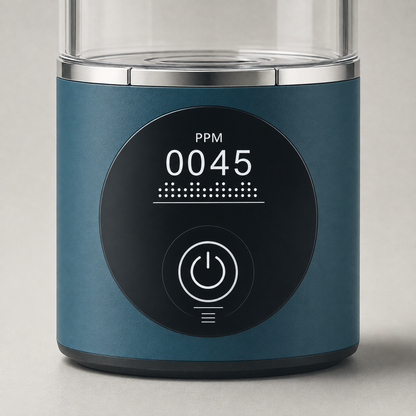 Macro of the round black panel on the base, reading PPM 0045 above a dotted bar, with the power touch button below
