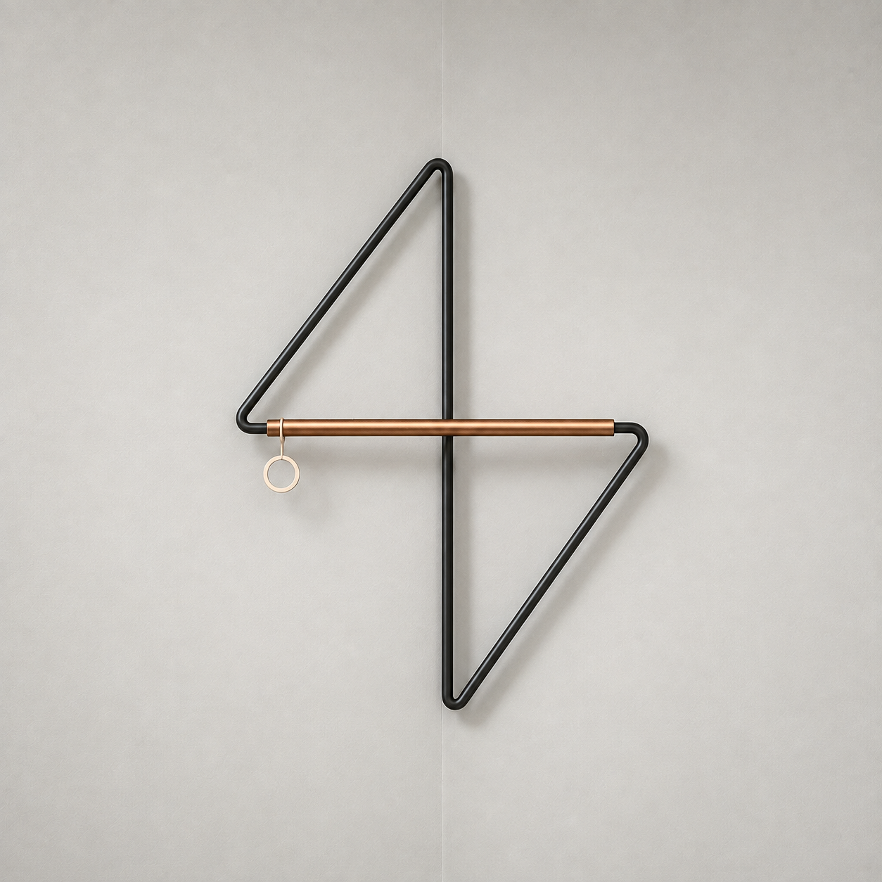 Front view of the black metal corner coat rack on a plain grey background, with the upper arm to the left, the lower arm to the right, the crossbar across the middle and a ring at its left end.