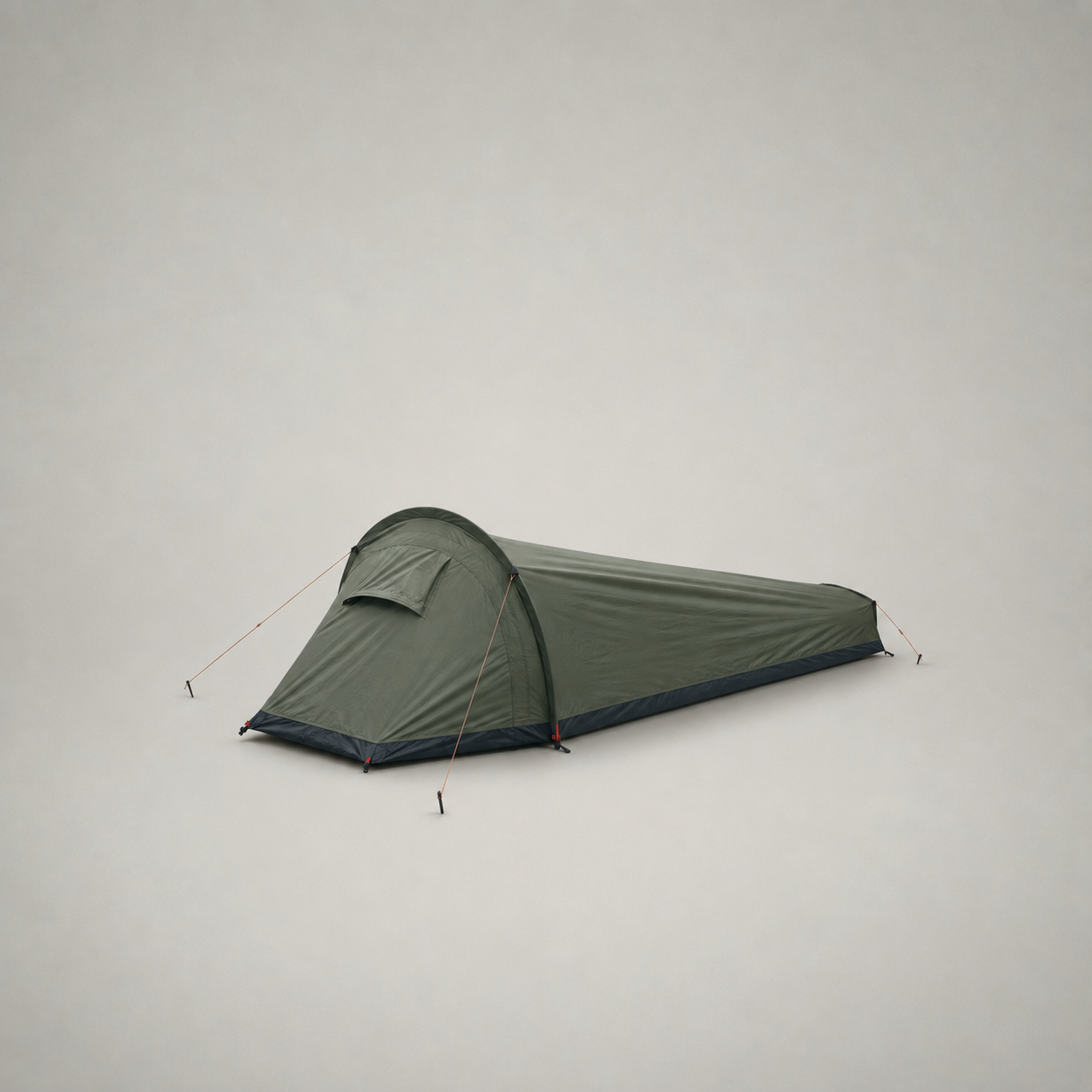 Army Green one-person backpacking tent pitched on a plain grey studio background