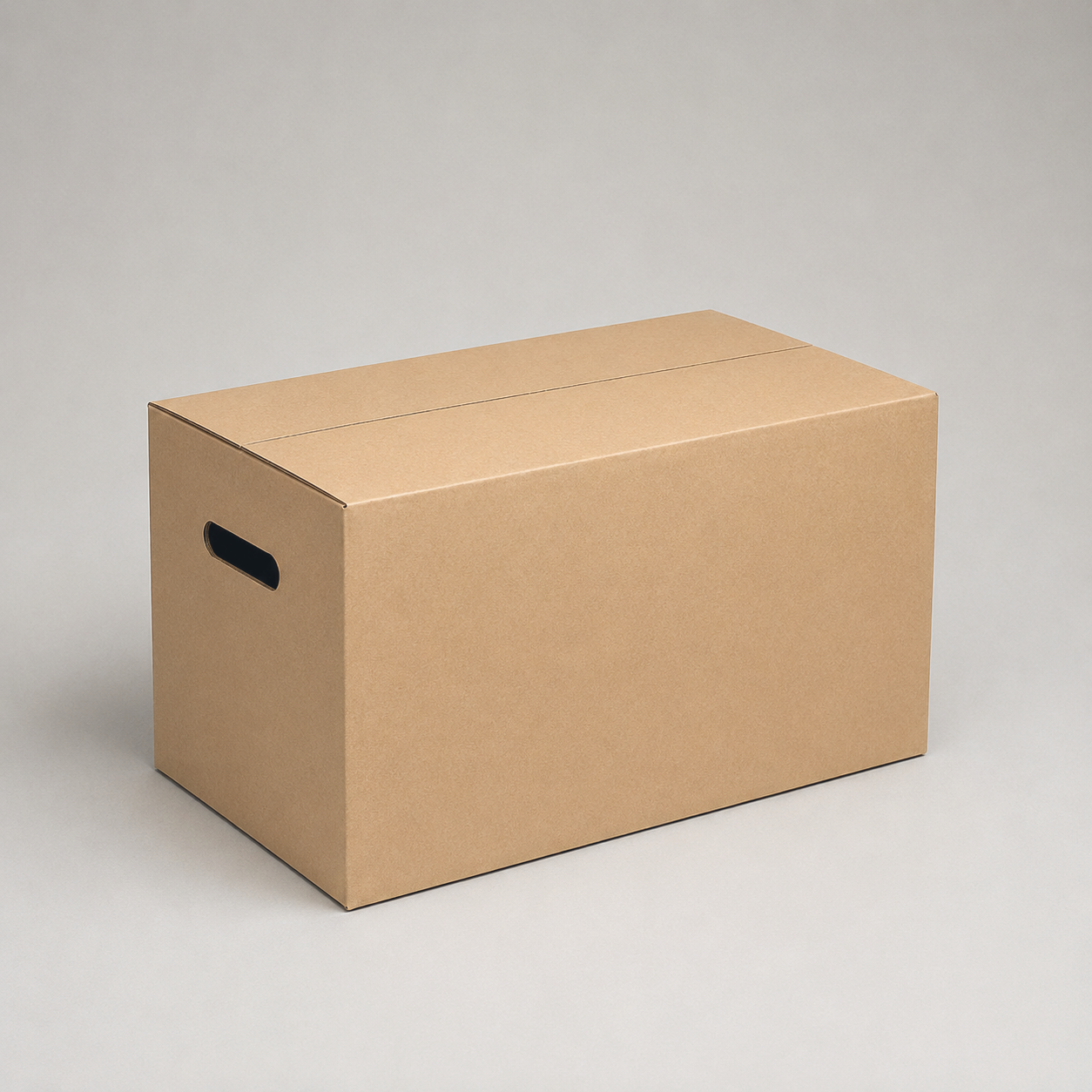 Closed cardboard moving box on a plain gray background, three-quarter view from the front left