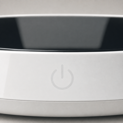 Close-up of the warmer's top edge showing the black glass plate and the power symbol