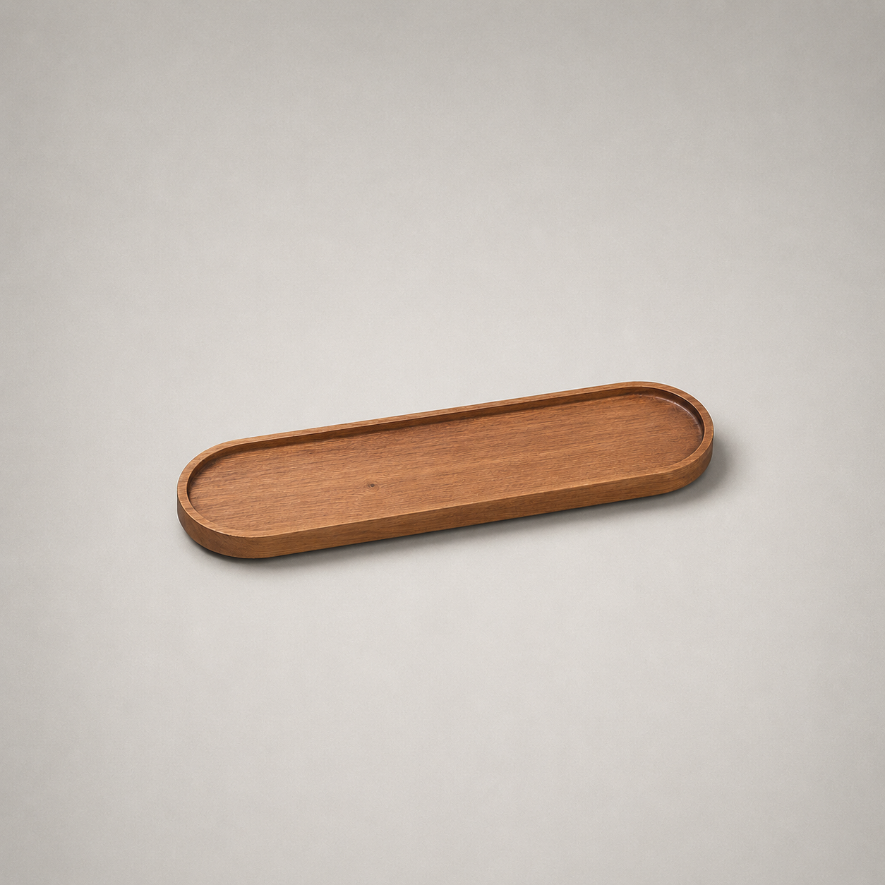 Large oval wooden coffee tray on a plain grey studio background