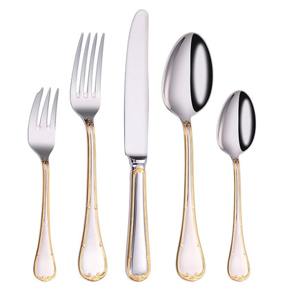 Cake fork, dinner fork, dinner knife, dinner spoon and teaspoon standing in a row on white