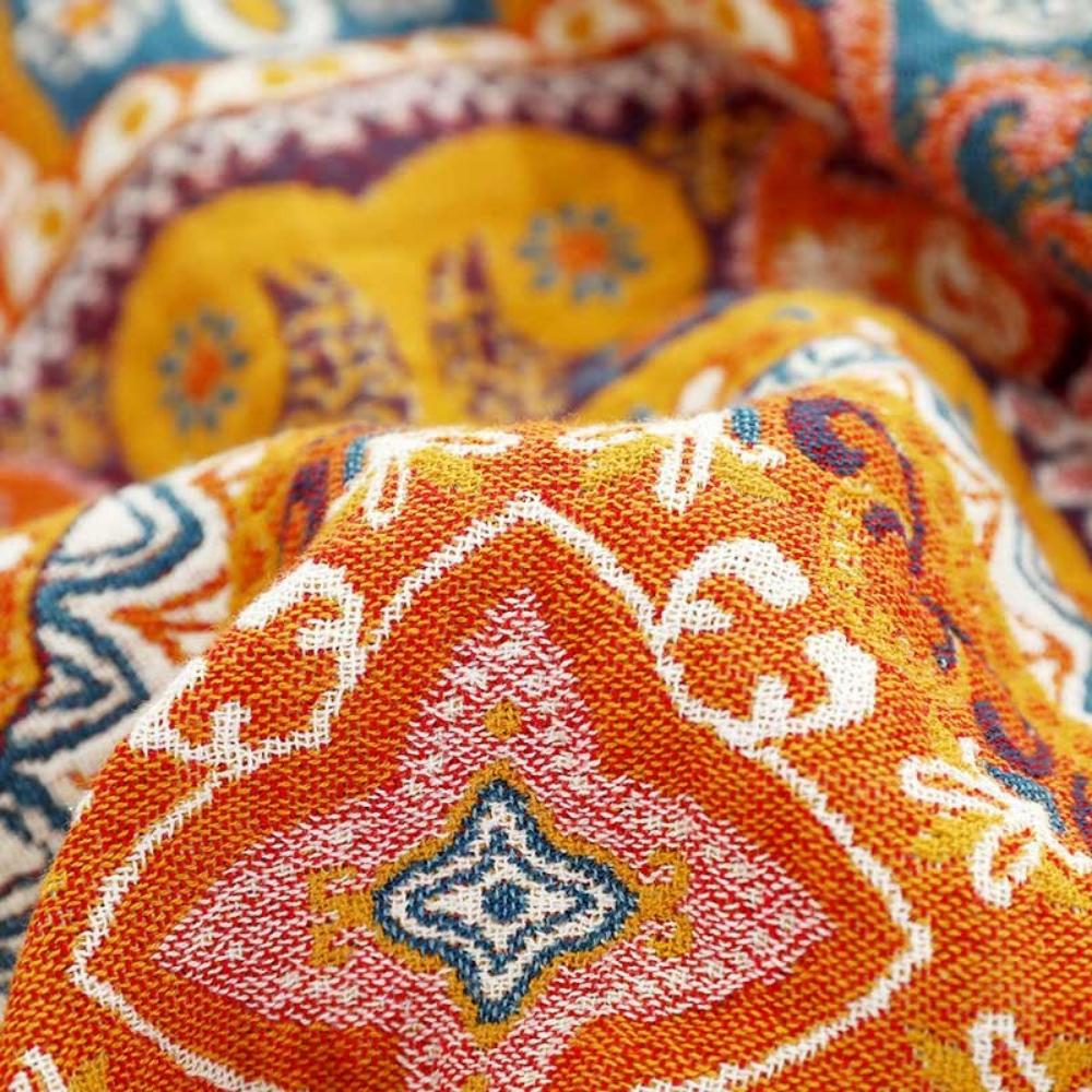 Close-up of the woven cotton medallion with its pink and teal star centre