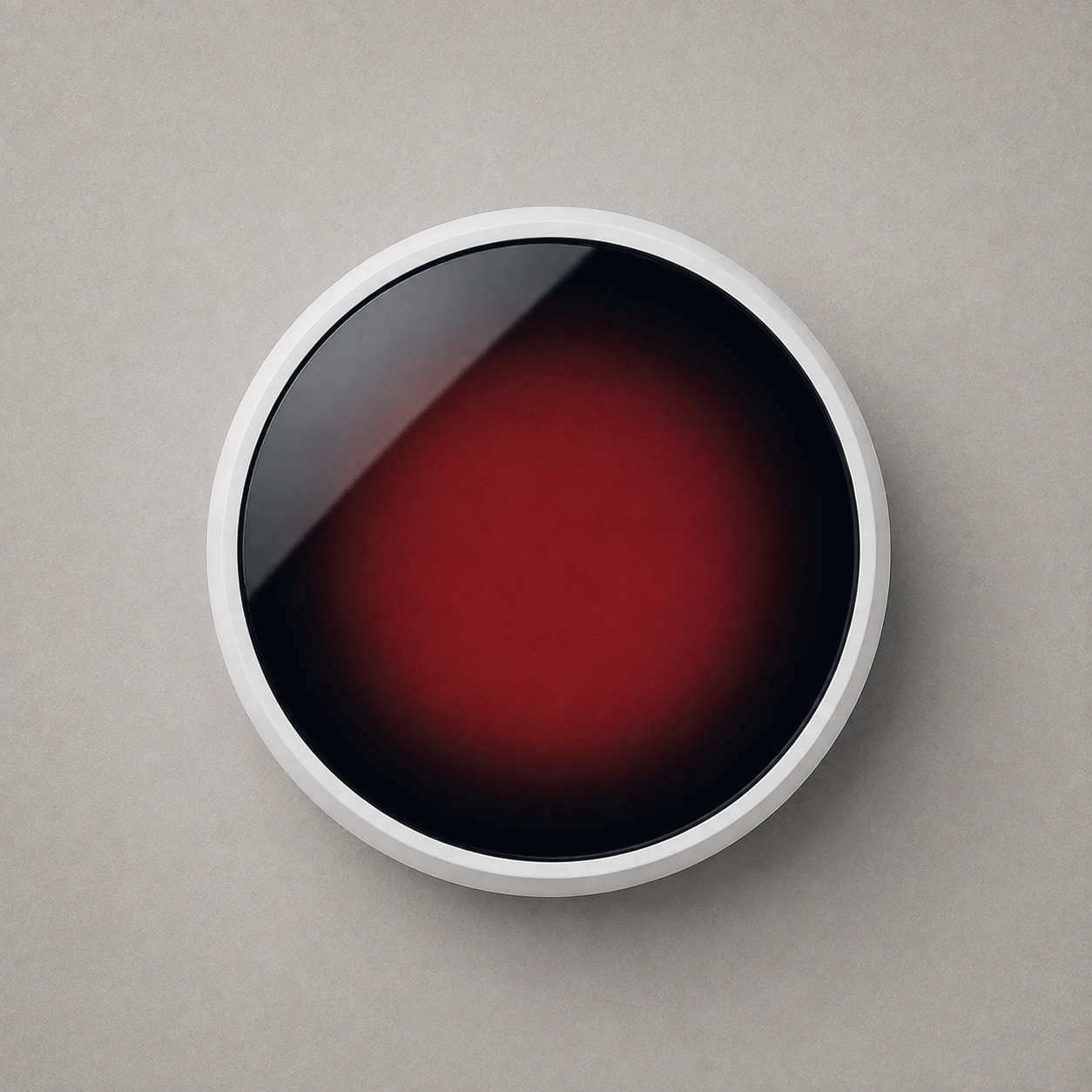 Mug warmer from above with the black glass plate glowing red on the higher setting