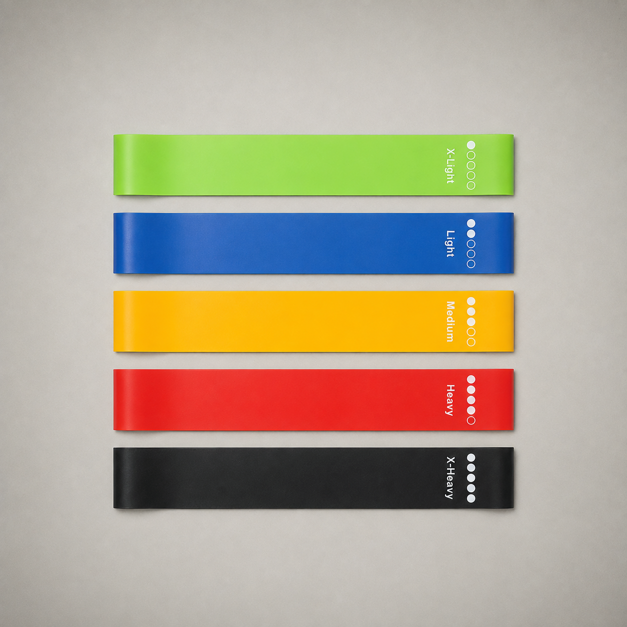 The five loop resistance bands that come in the set, laid out in order from X-Light to X-Heavy