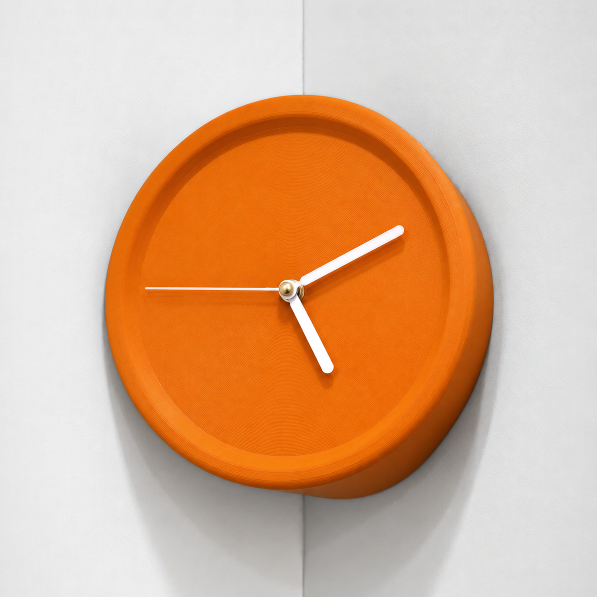 Orange corner wall clock in an inside wall corner, white hands